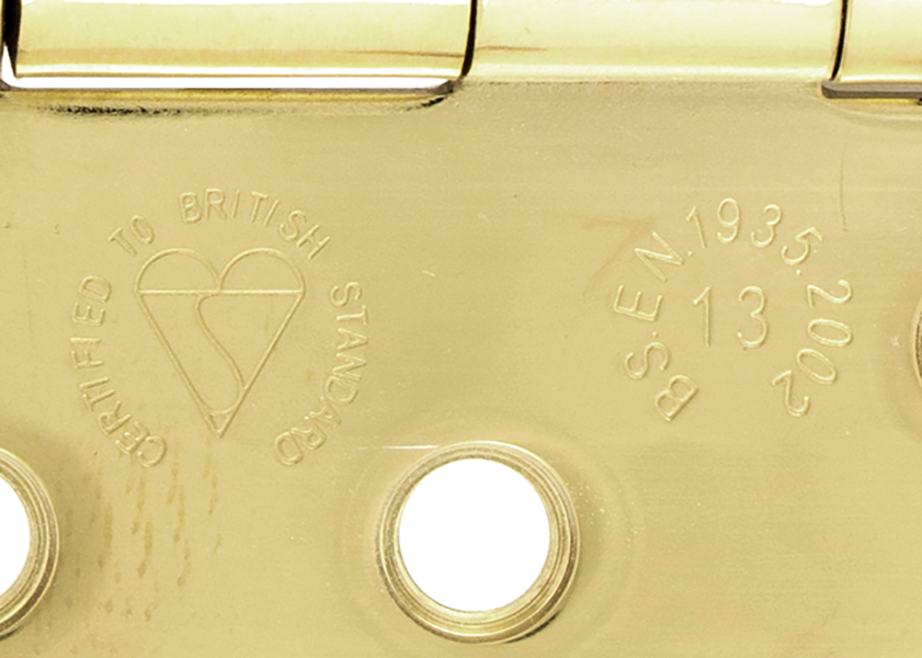 The British Standard Kitemark and BS EN 1935:2002 Grade 13 mark on brass butt hinge.