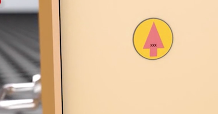 Fire Doors may be marked with a certification that is a coloured circular plug with a coloured arrow design.